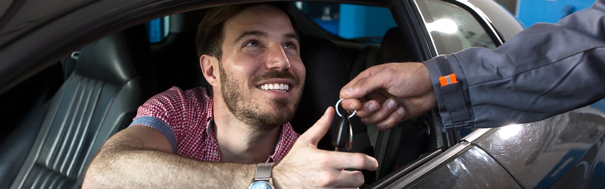 Satisfied Male Customer receiving car keys | All Star Automotive Group in Baton Rouge LA